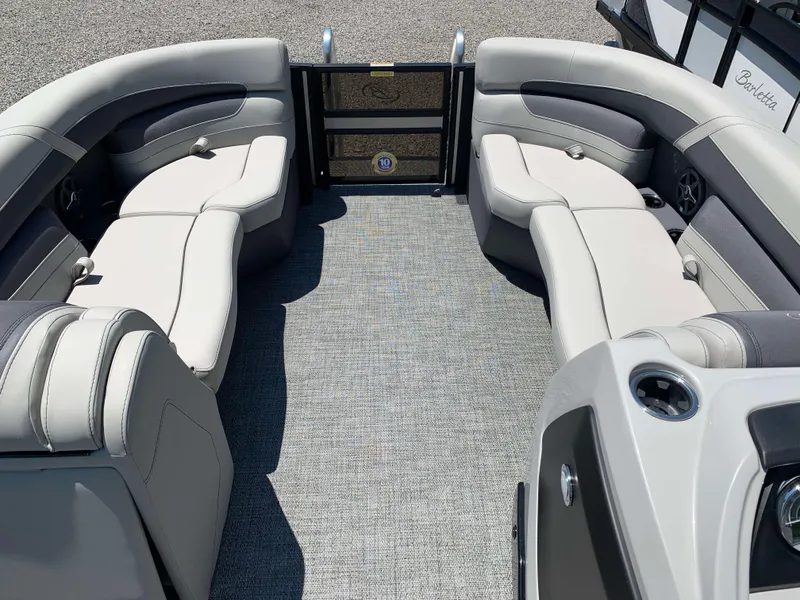 Slide: The Image of 2025 Barletta Cabrio 22UC pontoon boat interior with plush seating and modern design. - 3