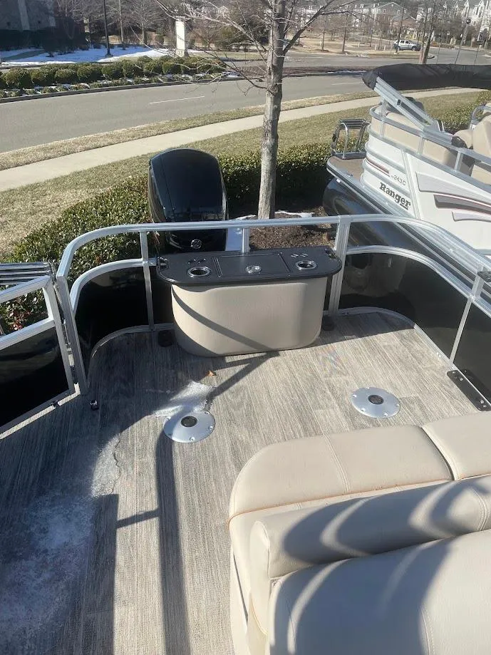 Slide: The Image of 2024 Ranger Reata 220F boat deck with seating and control panel. - 3
