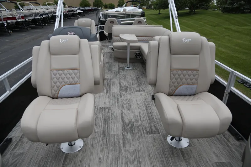 Slide: The Image of 2024 Ranger Reata 220F boat interior with plush seating and modern design. - 5