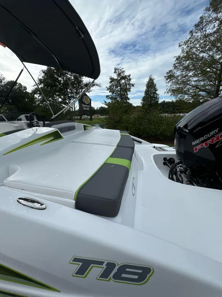 Slide: The Image of 2024 Tahoe T18 boat with Mercury engine, sleek design, outdoor setting. - 6