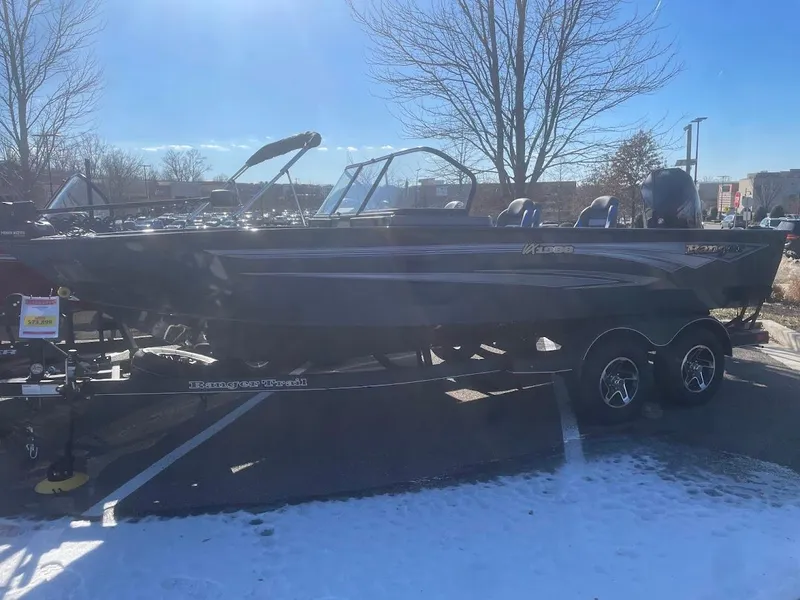 The Image of 2024 Ranger VX1988 WT boat on trailer in snowy parking lot. - 0