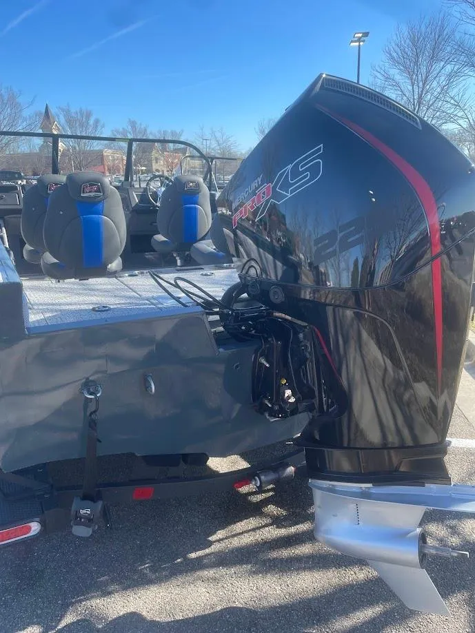 Slide: The Image of 2024 Ranger VX1988 WT boat with powerful outboard motor, parked outdoors. - 3