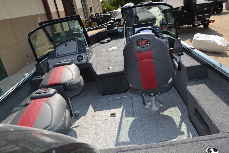 Slide: The Image of 2024 Ranger VS1782SC Angler boat interior with red and gray seating. - 2