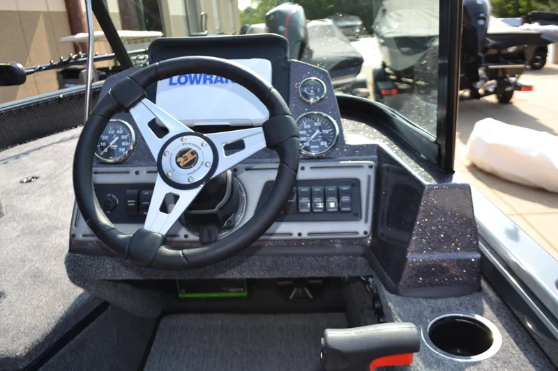 Slide: The Image of 2024 Ranger VS1782SC Angler boat dashboard with steering wheel and control panel. - 3