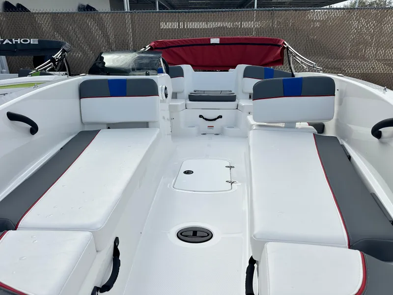 Slide: The Image of 2024 Tahoe T18 boat interior with white seating and red accents. - 3