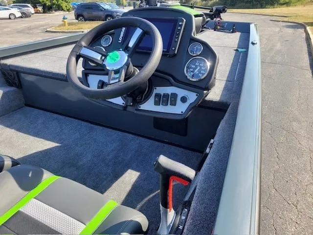 Slide: The Image of 2024 Ranger RT188 boat interior with steering wheel and dashboard controls. - 3