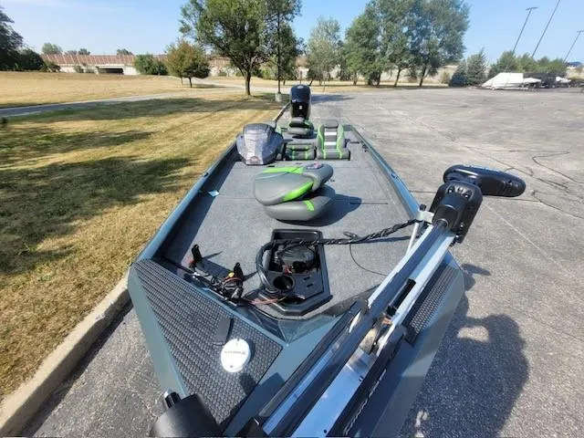 Slide: The Image of 2024 Ranger RT188 fishing boat with modern equipment in a parking lot. - 4