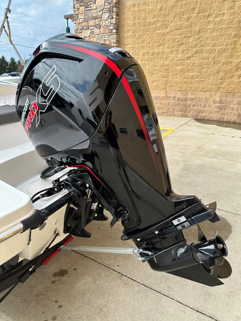 Slide: The Image of 2024 Tahoe T18 boat with sleek black and red outboard motor. - 3