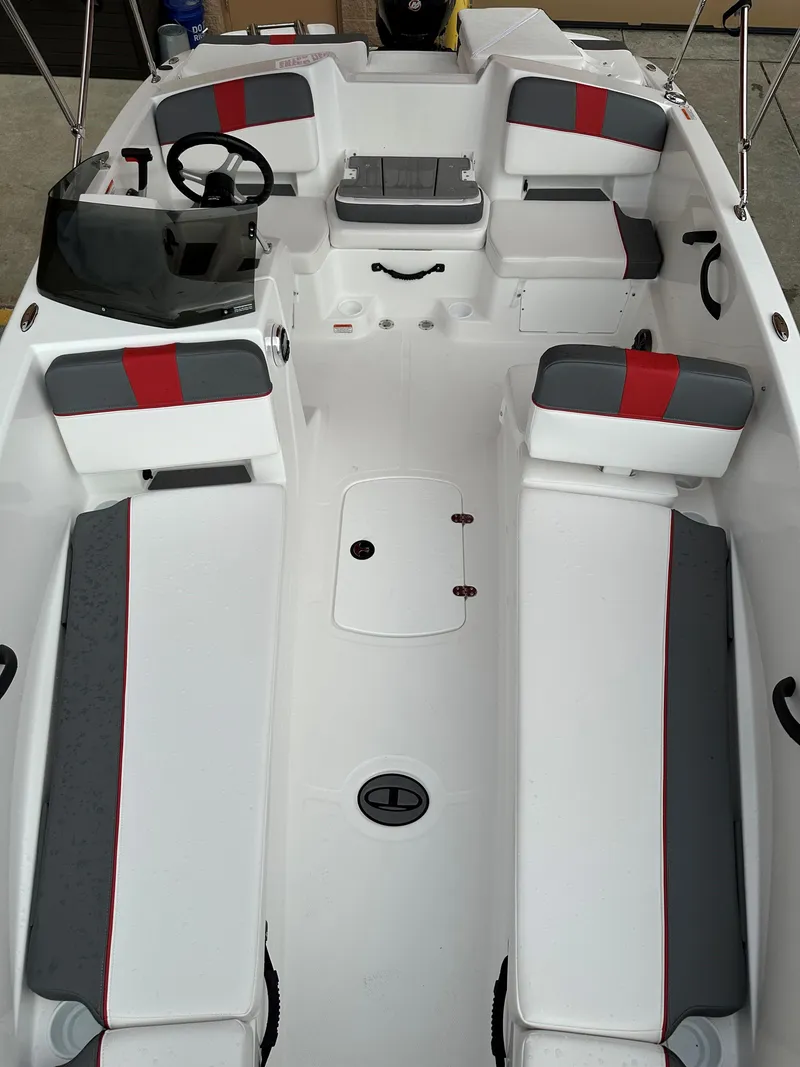 Slide: The Image of 2024 Tahoe T18 boat interior with red and gray seating accents. - 5