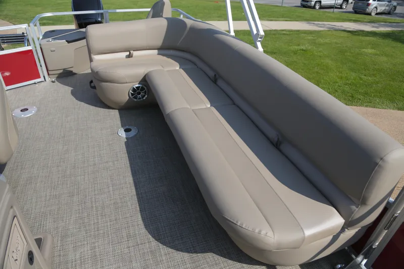 Slide: The Image of 2024 Ranger Reata 200F boat interior with beige seating and carpeted flooring. - 5