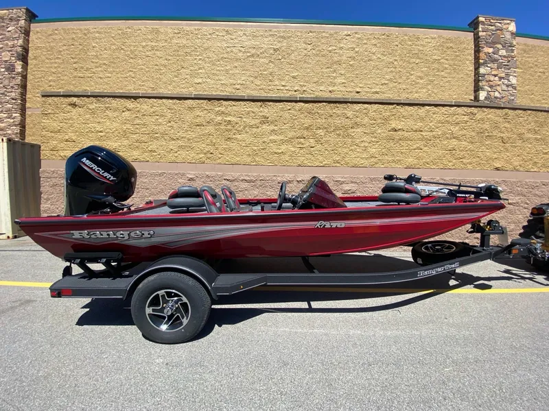 The Image of 2024 Ranger RT178 boat in red, parked on a trailer, side view. - 0