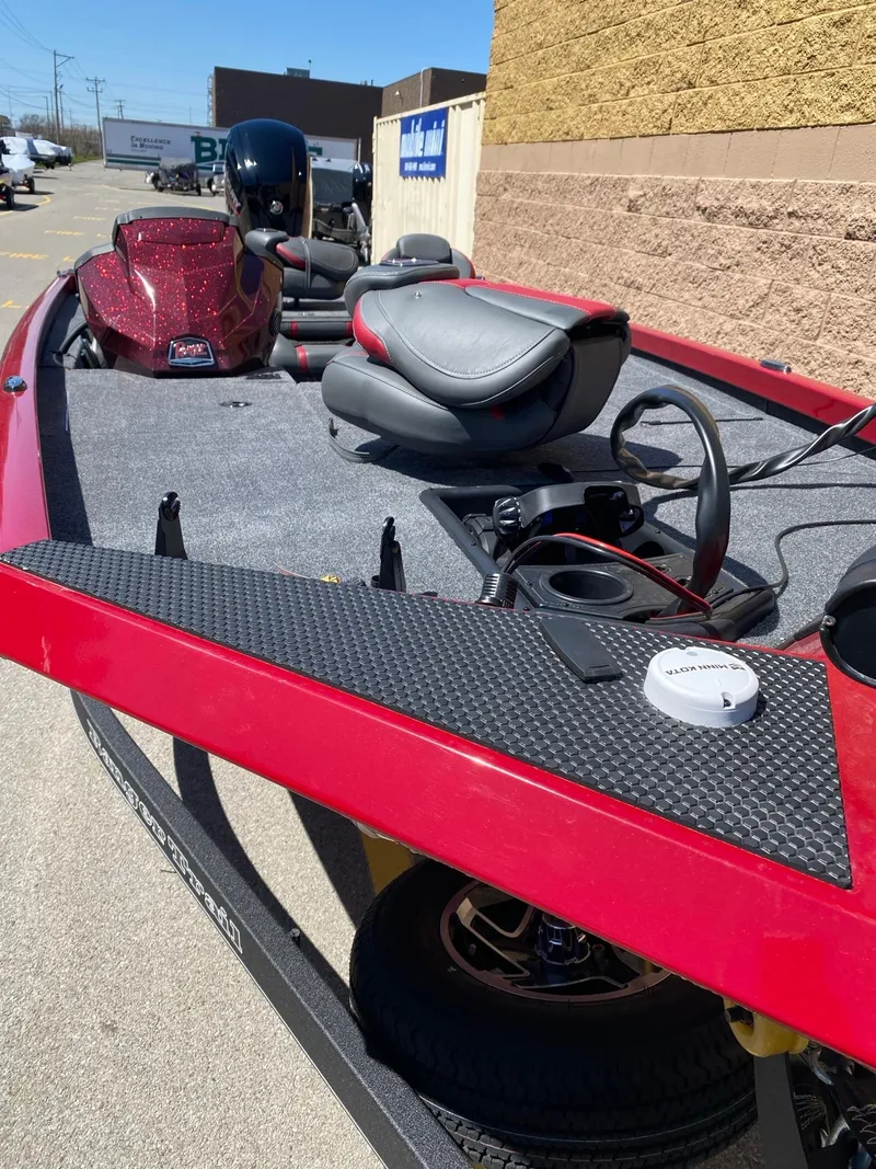 Slide: The Image of 2024 Ranger RT178 boat, red exterior, gray interior, parked outdoors. - 4