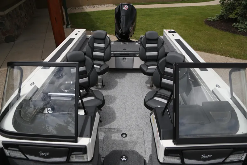 Slide: The Image of 2024 Ranger VX1988 WT boat interior with seating and motor, showcasing modern design. - 4