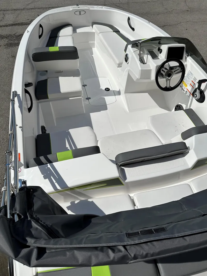 Slide: The Image of 2024 Tahoe T16 boat interior with modern seating and steering wheel. - 4