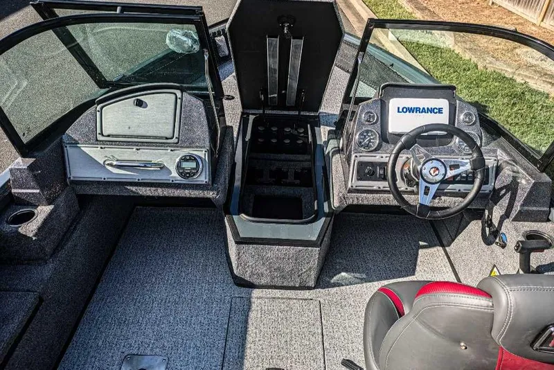 Slide: The Image of 2024 Ranger VS1682SC Angler boat interior with steering wheel and Lowrance display. - 2