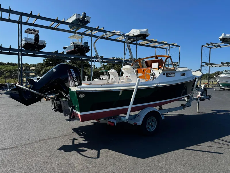 Slide: The Image of 2015 Devlin Pelicano 20 boat on trailer in marina storage area. - 10