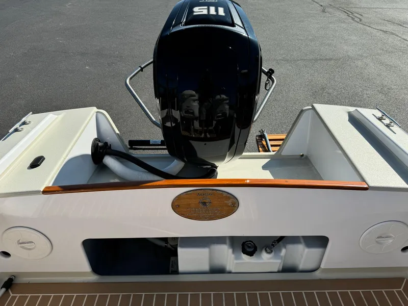 Slide: The Image of Devlin Pelicano 20 boat, 2015 model, featuring a powerful outboard motor. - 17