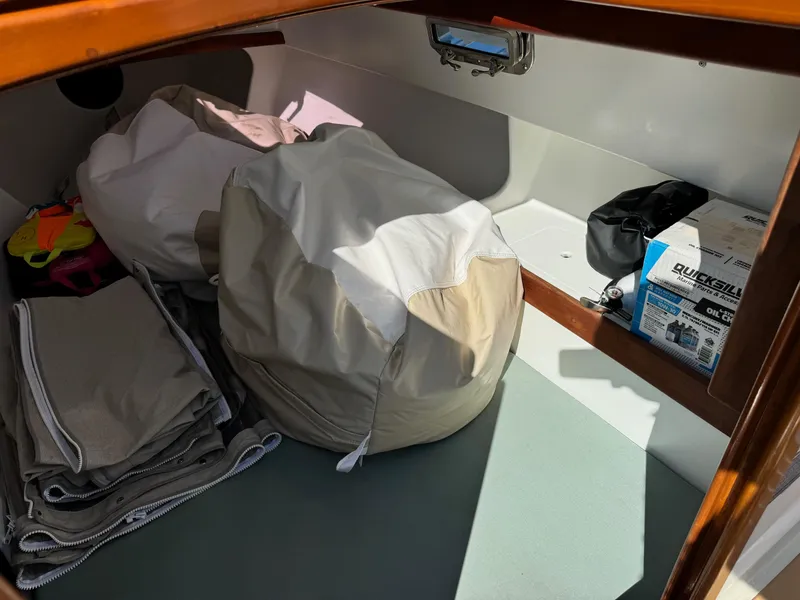 Slide: The Image of Interior storage of 2015 Devlin Pelicano 20 boat with bags and equipment. - 21