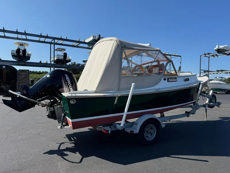 Slide: The Image of 2015 Devlin Pelicano 20 boat on trailer with Mercury outboard motor. - 3