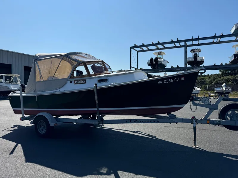 Slide: The Image of Devlin Pelicano 20 boat on trailer, 2015 model, parked outdoors. - 4