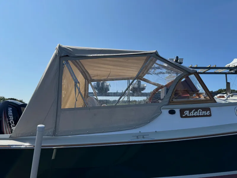 Slide: The Image of Devlin Pelicano 20 boat, 2015 model, with canopy and "Adeline" nameplate. - 5