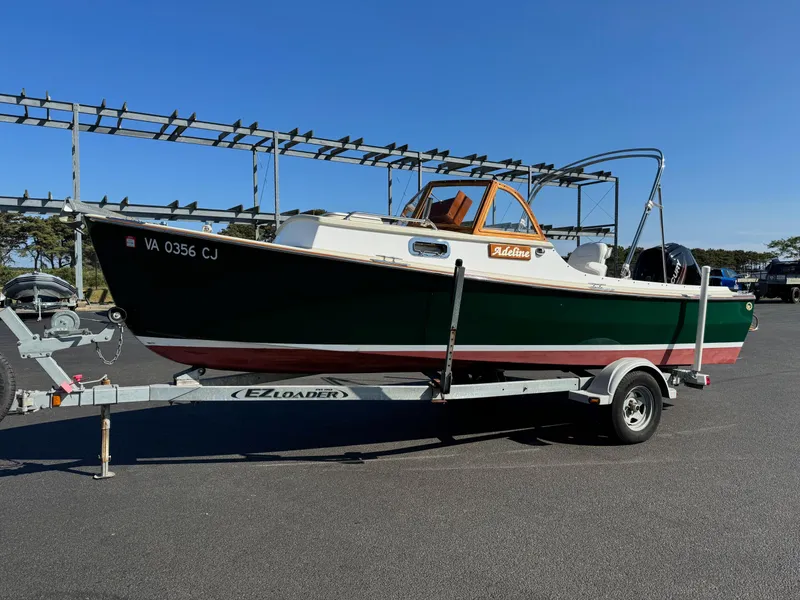 Slide: The Image of 2015 Devlin Pelicano 20 boat on trailer in parking lot. - 8