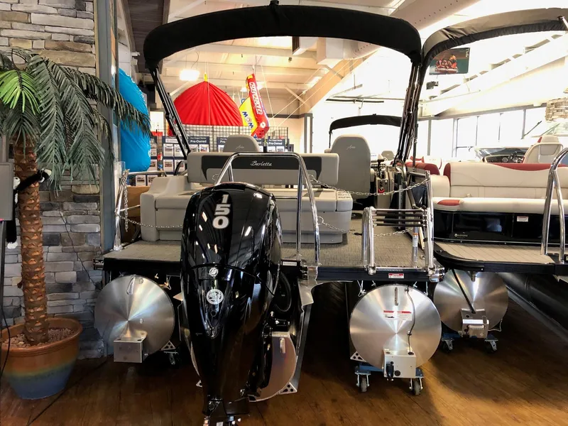 Slide: The Image of 2025 Barletta ARIA 20UC pontoon boat with 150 HP engine in showroom. - 3