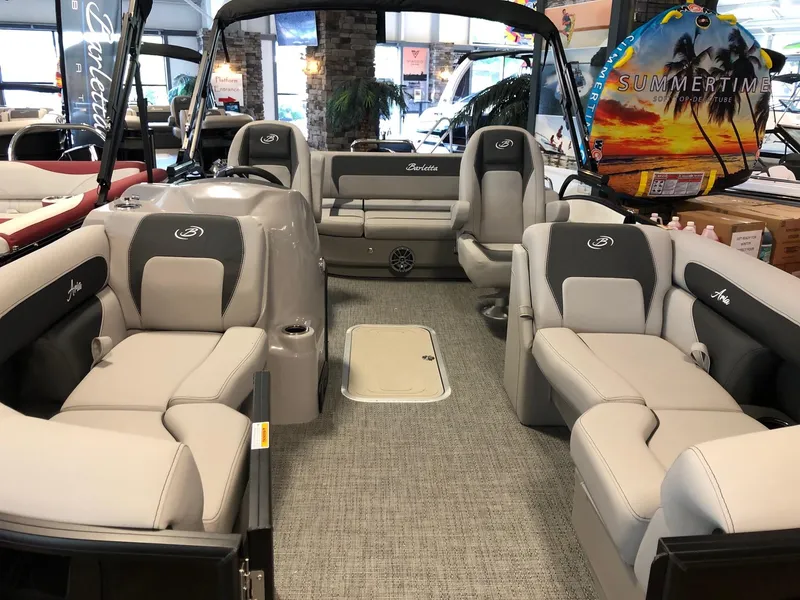 Slide: The Image of 2025 Barletta ARIA 20UC pontoon boat interior with plush seating and modern design. - 5