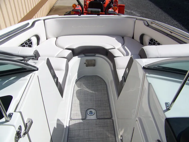 Slide: The Image of 2023 Crownline Eclipse E255 boat interior with white seating and sleek design. - 10