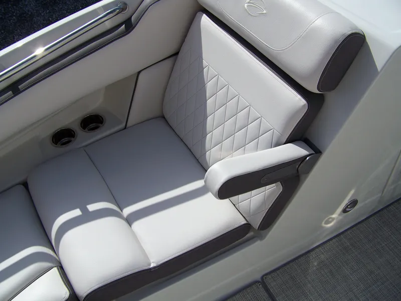 Slide: The Image of 2023 Crownline Eclipse E255 boat seat with quilted upholstery and armrest. - 12