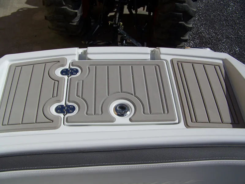 Slide: The Image of 2023 Crownline Eclipse E255 boat deck with non-slip surface and storage compartments. - 14