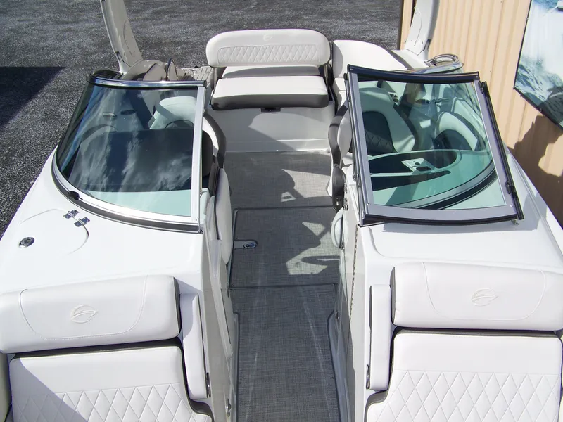 Slide: The Image of 2023 Crownline Eclipse E255 boat interior with plush seating and sleek design. - 15