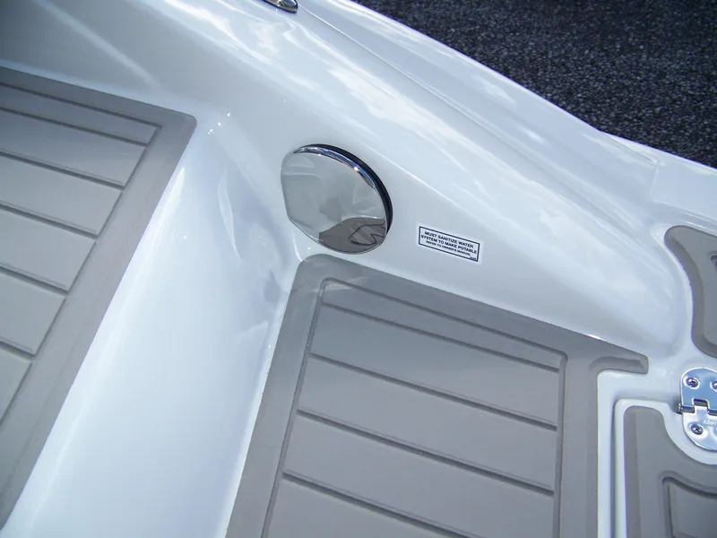 Slide: The Image of 2023 Crownline Eclipse E255 boat interior with non-slip flooring and chrome details. - 18