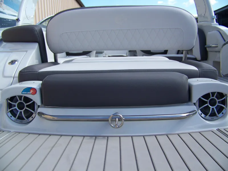 Slide: The Image of 2023 Crownline Eclipse E255 boat seating with speakers and sleek design. - 19