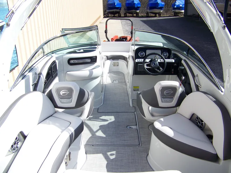 Slide: The Image of 2023 Crownline Eclipse E255 boat interior with modern seating and dashboard. - 3