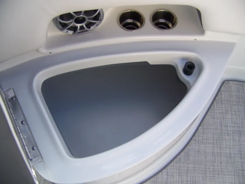 Slide: The Image of 2023 Crownline Eclipse E255 boat interior with speaker and cup holders. - 5