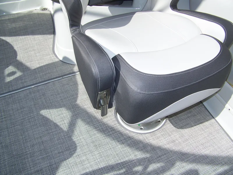 Slide: The Image of 2023 Crownline Eclipse E255 boat seat with gray carpet flooring. - 8