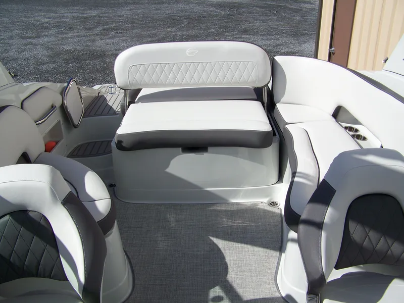 Slide: The Image of 2023 Crownline Eclipse E255 boat interior with plush seating and modern design. - 9