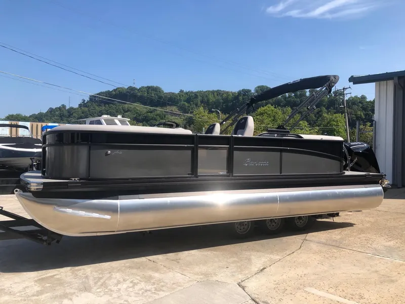The Image of 2025 Barletta ARIA 22QC pontoon boat on trailer, sunny day. - 1