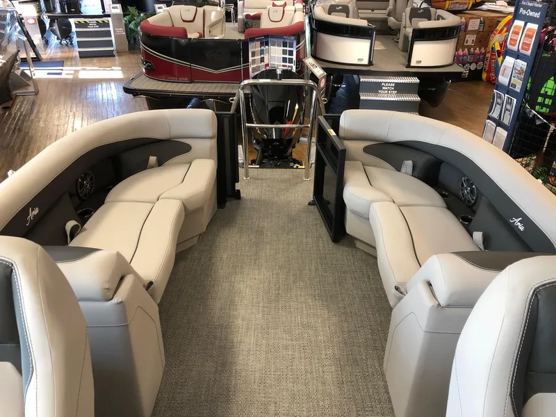 Slide: The Image of 2025 Barletta ARIA 22QC pontoon boat interior with plush seating and modern design. - 7