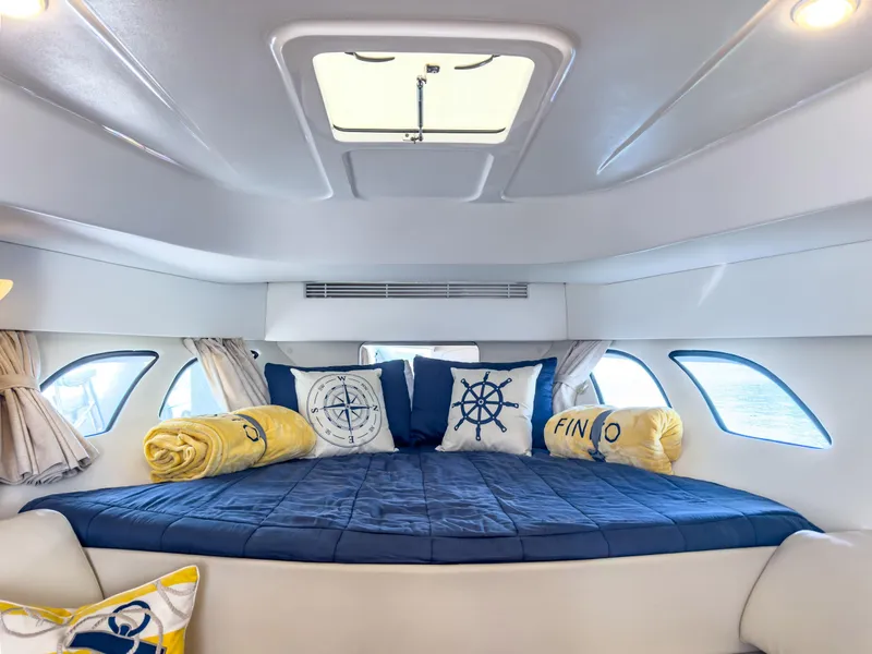 Slide: The Image of Interior cabin of 2017 Intrepid 430 Sport Yacht with nautical-themed bedding. - 12