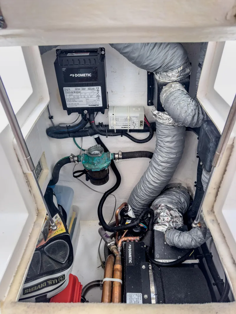 Slide: The Image of Engine compartment of a 2017 Intrepid 430 Sport Yacht with visible components and wiring. - 22