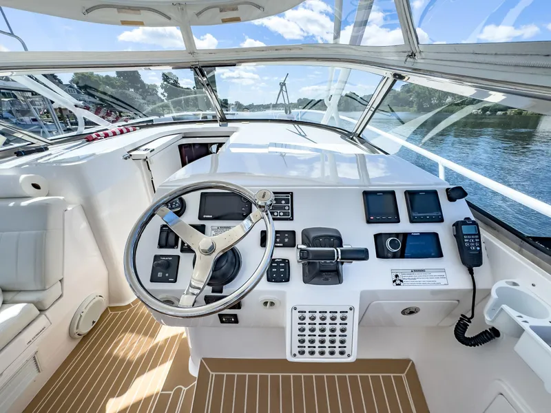 Slide: The Image of Cockpit of 2017 Intrepid 430 Sport Yacht with modern controls and navigation equipment. - 26