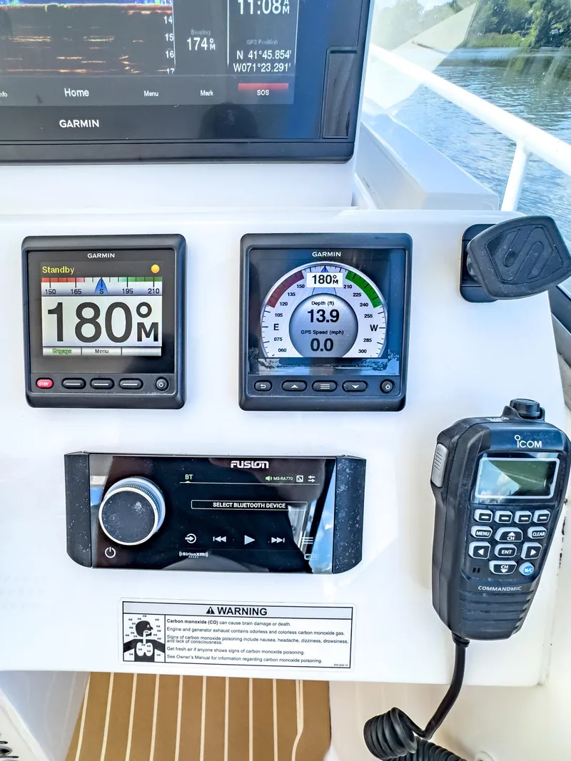 Slide: The Image of Control panel of a 2017 Intrepid 430 Sport Yacht with navigation and communication devices. - 28