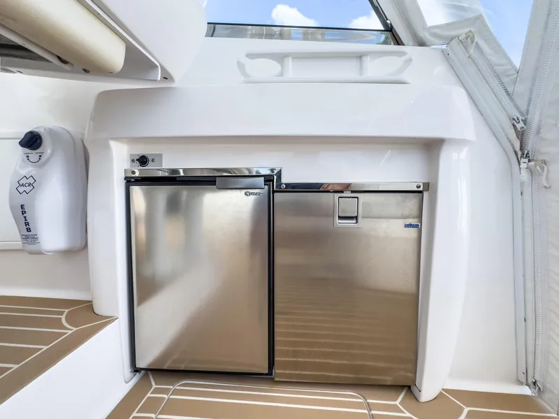 Slide: The Image of 2017 Intrepid 430 Sport Yacht interior with stainless steel fridge and sleek design. - 35