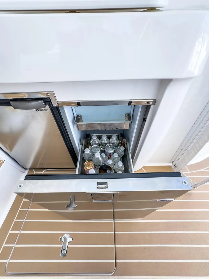 Slide: The Image of Built-in cooler with drinks on 2017 Intrepid 430 Sport Yacht. - 37