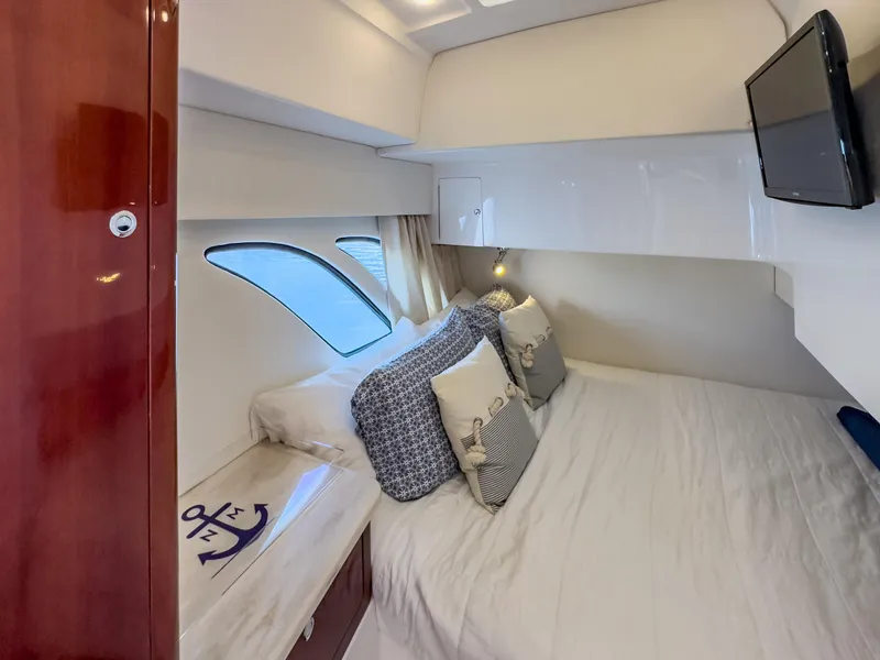 Slide: The Image of Luxurious cabin interior of 2017 Intrepid 430 Sport Yacht with cozy bedding and modern decor. - 4