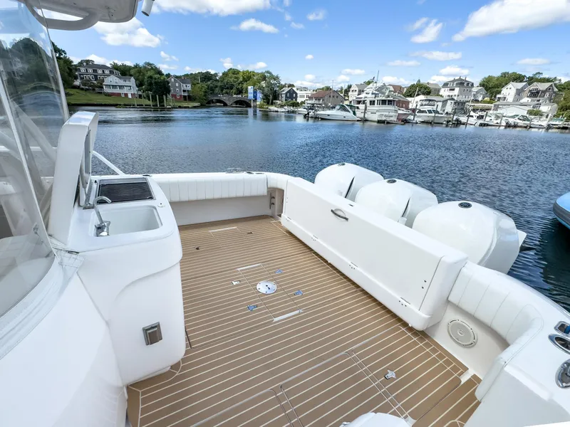 Slide: The Image of 2017 Intrepid 430 Sport Yacht deck with scenic marina view. - 41