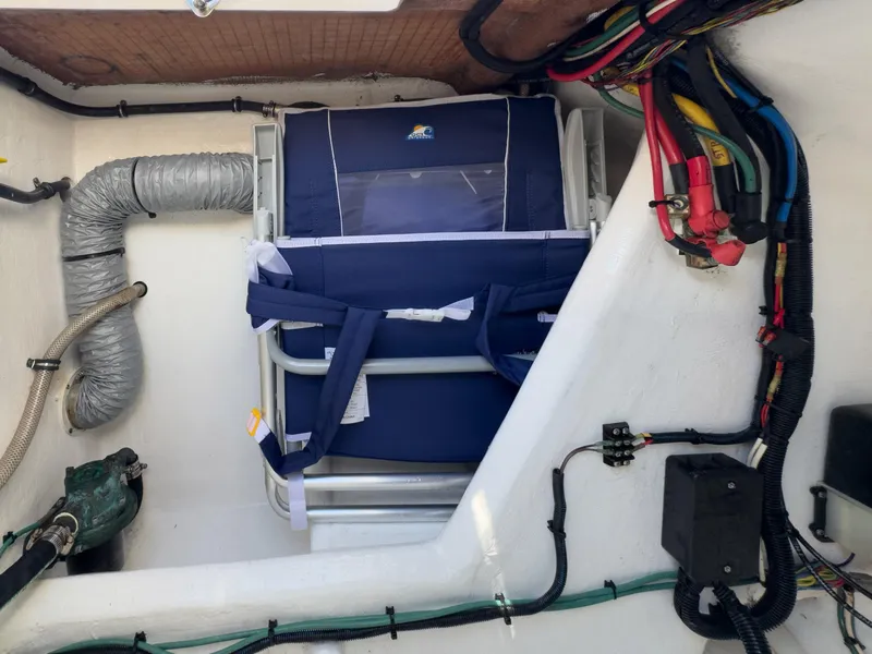 Slide: The Image of 2017 Intrepid 430 Sport Yacht interior with wiring and equipment storage. - 47