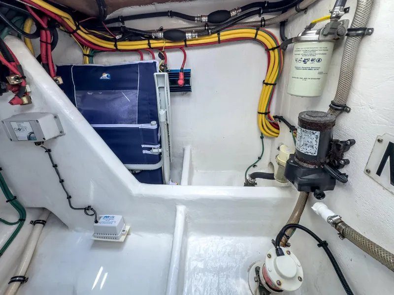 Slide: The Image of Engine room of a 2017 Intrepid 430 Sport Yacht with wiring and equipment. - 49